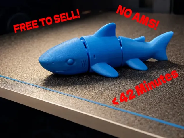 Blue articulated flexi shark 3D print with a big cartoon grin